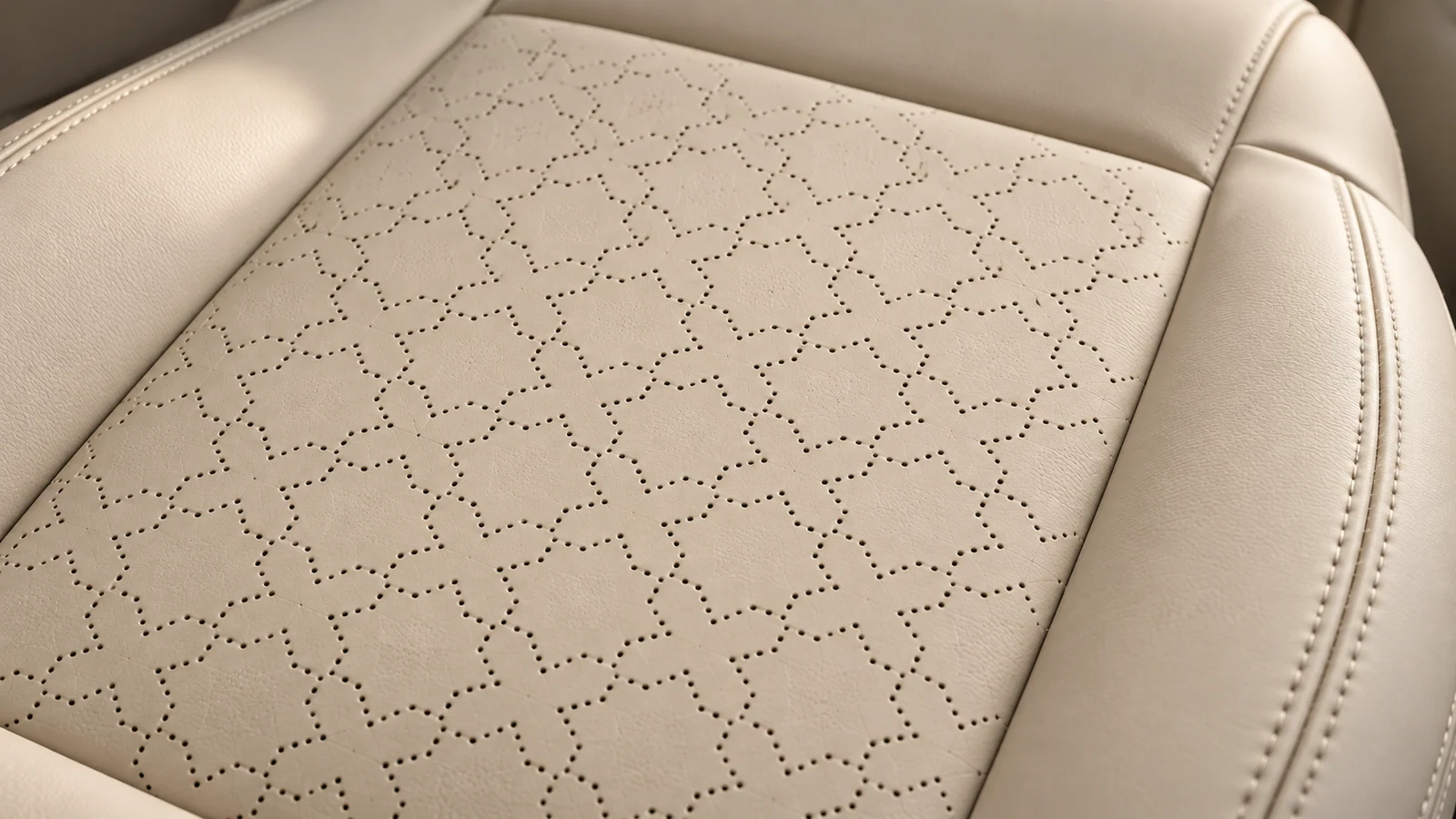 Bone leather with precise geometric perforations and hand-finished stitching