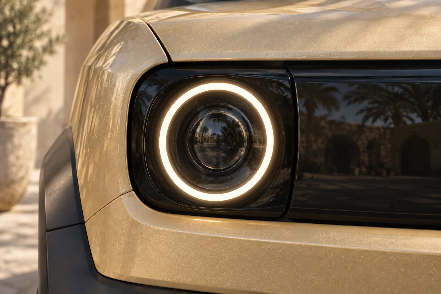Circular projector and warm halo in a clean black front fascia